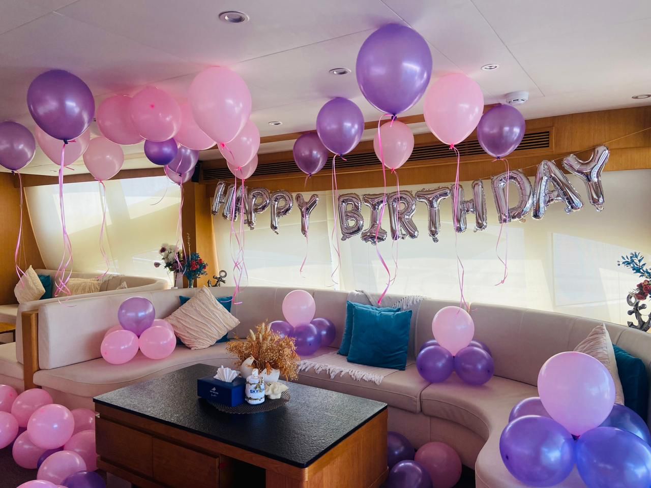 Bachelor/ Bachelorette Package | AnchorsBook Photo A luxury yacht with birthday decorations and balloons in dubai rented on AnchorsBook for a birthday party boat rental